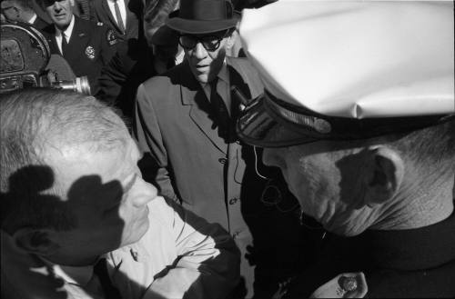 Image of Dallas Sheriff Bill Decker awaiting the arrival of Lee Harvey Oswald