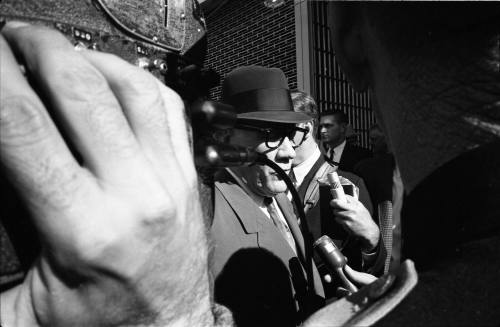 Image of Dallas Sheriff Bill Decker awaiting the arrival of Lee Harvey Oswald