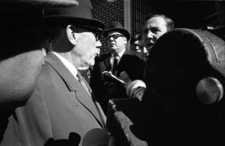 Image of Dallas Sheriff Bill Decker awaiting the arrival of Lee Harvey Oswald