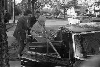 Image of Jack Ruby's sister Eva Grant leaving for the Dallas Police Department