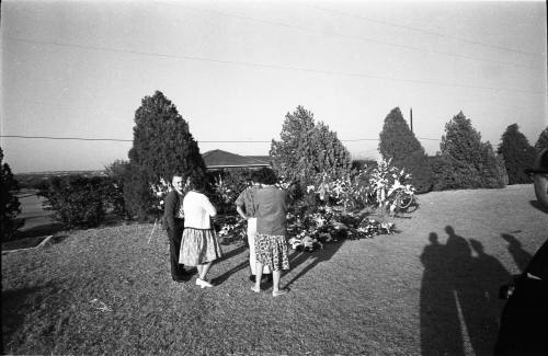 Image of a group of people graveside at Rose Hill Memorial Park