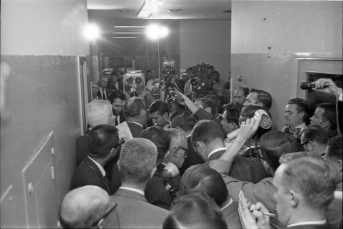 Image of Dallas Police Chief Jesse Curry interviewed in hallway