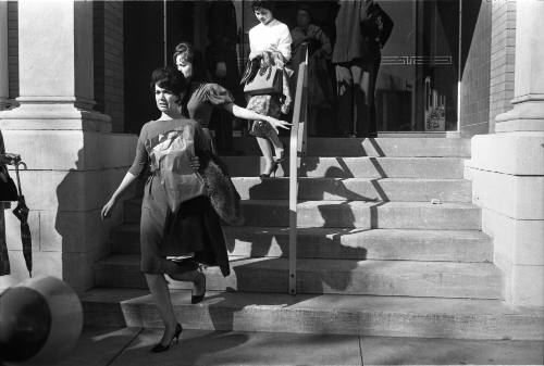 Image of employees exiting the Texas School Book Depository