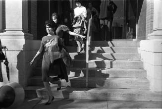 Image of employees exiting the Texas School Book Depository