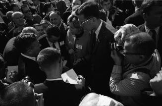 Image of Senator Ralph Yarborough giving interviews outside Parkland Hospital