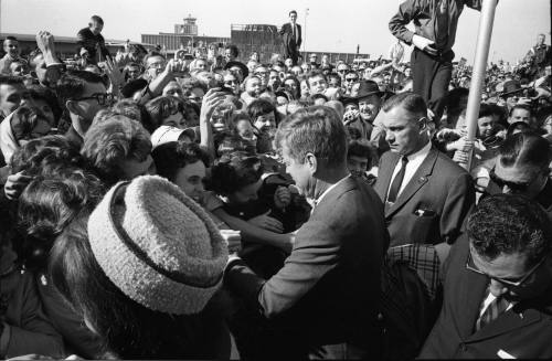 Image of the Kennedys greeting the crowd at Love Field