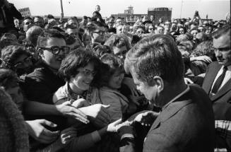 Image of President Kennedy greeting the crowd at Love Field