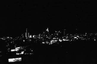 Image of the Dallas skyline on the night of November 22, 1963
