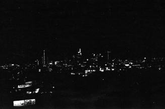 Image of the Dallas skyline on the night of November 22, 1963