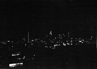 Image of the Dallas skyline on the night of November 22, 1963