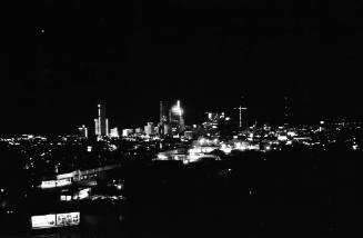Image of the Dallas skyline on the night of November 22, 1963