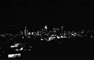 Image of the Dallas skyline on the night of November 22, 1963