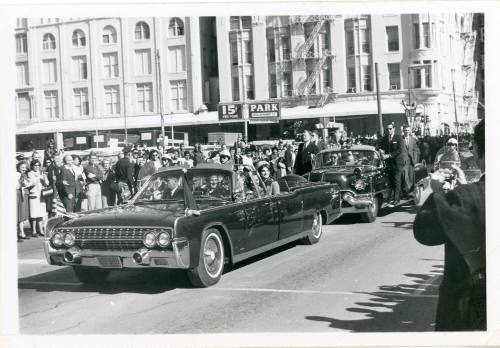 Black and white photograph of the presidential limousine in Dallas