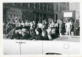 Black and white photograph of Vice President Johnson's car in the motorcade