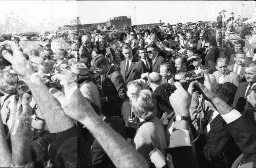 Image of the Kennedys greeting the crowd at Love Field