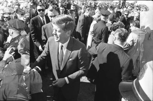 Image of President Kennedy greeting the crowd at Love Field