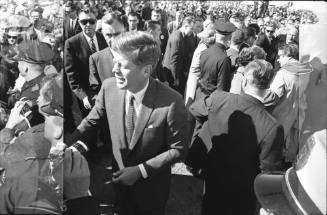 Image of President Kennedy greeting the crowd at Love Field