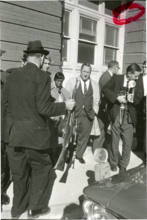 Image from contact sheet of Lieutenant J.C. "Carl" Day with rifle