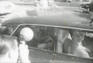 Image from contact sheet of Texas School Book Depository employees in police car