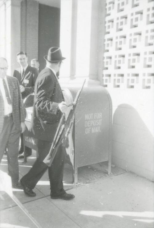 Image from contact sheet of Lieutenant J.C. 'Carl' Day with the rifle