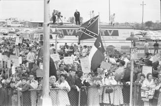 Image of the crowd gathered at Love Field to welcome President Kennedy to Dallas