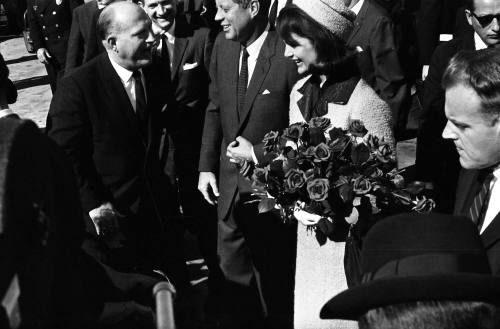 Image of the Kennedys talking to Rev. Baxton Bryant at Love Field