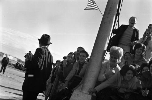 Image shows crowd at Love Field waiting to see President Kennedy