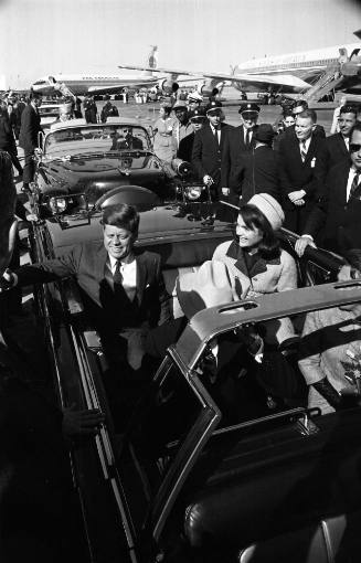 Image of President and Jacqueline Kennedy in the limousine at Love Field