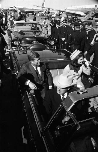 Image of President and Mrs. Kennedy in the limousine at Love Field
