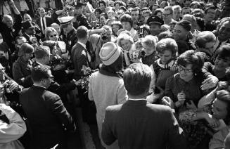 Image of President and Jackie Kennedy greeting the crowd at Love Field