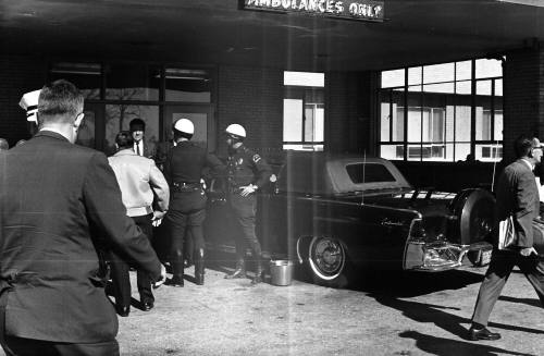 Image of the presidential limousine with the top on at Parkland Hospital