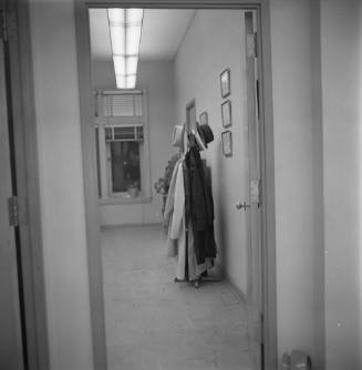 Image of Governor Connally's blood-spattered hat hanging in Jesse Curry's office