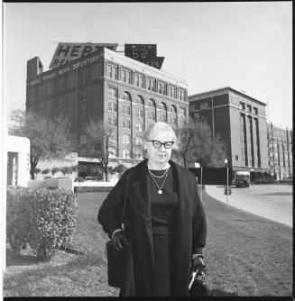 Image of Oswald's mother Marguerite in front of the Texas School Book Depository