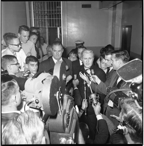 Image of Ruby's lawyers Tonahill and Belli besieged by reporters