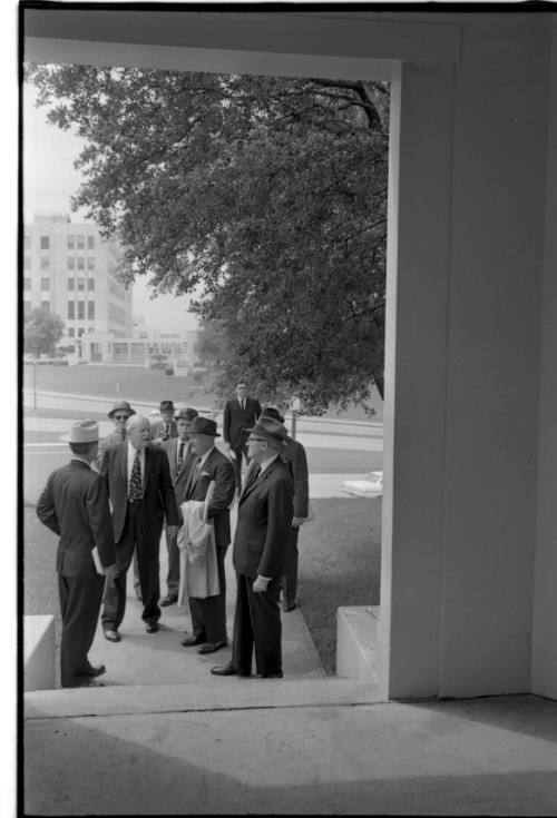 Image of members of the Warren Commission near the grassy knoll