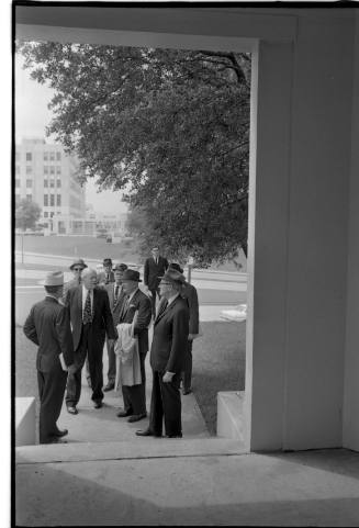 Image of members of the Warren Commission near the grassy knoll