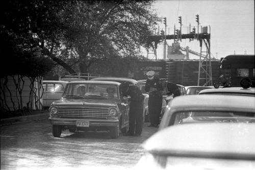 Image of Dallas Police officers stopping cars on the Elm Street extension