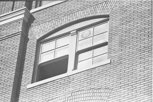 Image of a fifth floor window of the Texas School Book Depository