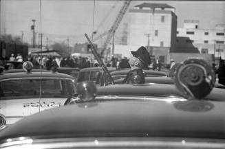 Image of a Dallas Police officer outside the Texas School Book Depository