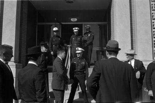 Image of Dallas Police officers on steps of the Texas School Book Depository