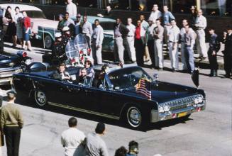 35mm color slide of presidential motorcade on Cedar Springs Road