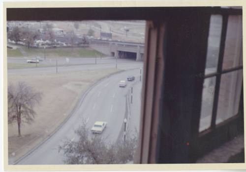 Color photo of the view of Dealey Plaza from the sixth floor corner window