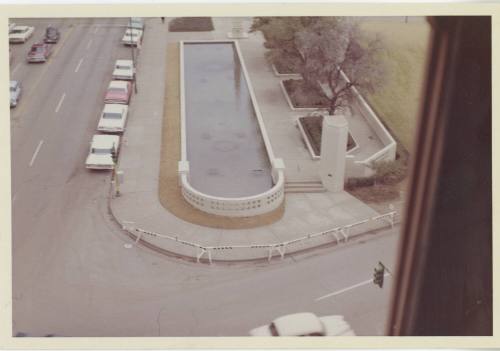 Color photo of the view of Dealey Plaza from the sixth floor corner window