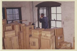 Color photo of men inside southeast sniper's perch corner of the sixth floor