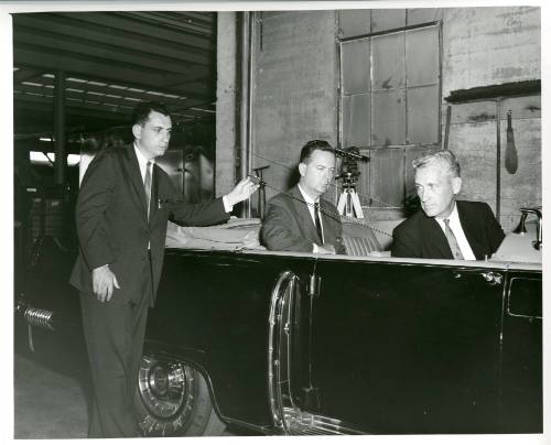 Photograph of FBI agents reenacting the Kennedy assassination