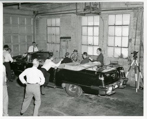 Black and white photograph of FBI reenactment of assassination