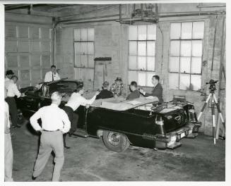 Black and white photograph of FBI reenactment of assassination