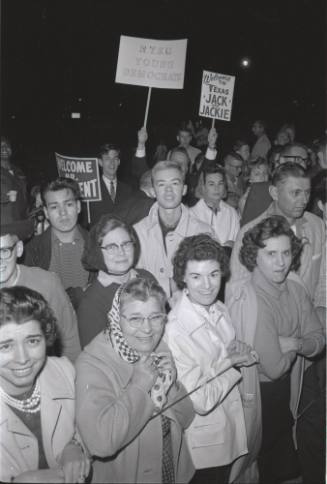 Image of a crowd with Kennedy signs Carswell Air Force Base in Fort Worth