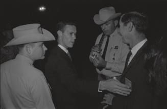 Image of law enforcement checking press credentials at Carswell Air Force Base