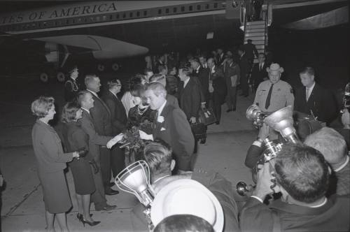 Image of presidential party greeting dignitaries at Carswell Air Force Base